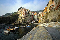 Fishing village of Riomaggiore on the coast of the Ligurian region of Cinque Terre, Italy.
