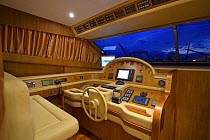 Cockpit of a Technema 65 motoryacht, built at the Rizzardi boatyard, cruising in the Mediterranean at night, Italy.
