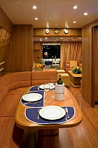 Seating and dining area in the luxurious interior of a Technema 65, built at the Rizzardi boatyard. Italy.
