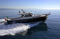 Portland 55 motoryacht, built by Abati yachts, cruising the Mediterranean. Tuscany, Italy.