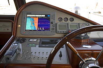 Steering wheel and controls of a Portland 55 motoryacht, built by Abati yachts in 2006. Mediterranean. Tuscany, Italy.