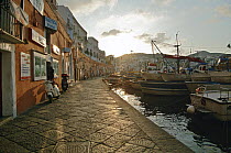 View of the waterfront at Ponza harbour at sunset, Ponza Island, Italy.