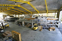 Fitters at work at the Cantieri Alfamarine boatyard, Fiumicino area of Lazio, Italy. Here men make final preparations to two luxurious Alfamarine 78' superyachts.