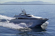 Luxurious 35-metre Gaia motoryacht, a model from the Cantieri Maiora boathouse, cruising along the mountainous coast of Viareggio, Italy.