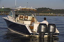 A couple relaxing on a Pursuit powerboat in Annapolis, Maryland, USA.