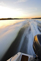 Outboard motor on a Pursuit powerboat travelling at speed, Annapolis, Maryland, USA.