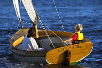 Cat rigged 12.5ft Herreshoff dinghy "Grace", sailed by Adrian van der Wal, Newport, Rhode Island, USA. Model and Property Released.