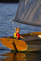 Cat rigged 12.5ft Herreshoff dinghy ^Grace^, sailed by Adrian van der Wal, Newport, Rhode Island, USA.