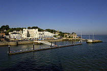 Cowes waterfront, with the new (2006) pontoon and breakwater haven marina off the Royal Yacht Squadron, UK.