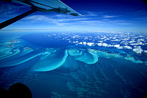 Aerial view, with aeroplane wing, of Exuma, part of the chain of 365 islands that form the Bahamas.