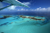 An aerial view, with aeroplane wing, of Exuma, part of the chain of 365 islands that form the Bahamas.