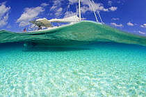 Split-level view of the hull of the Shannon Shoalsailor illustrating how this innovative, keelless, shallow draft beachboat is designed to roam shallow waters, Exuma, Bahamas. Property Released.