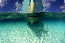 Split-level view of the hull of the Shannon Shoalsailor illustrating how this innovative, keelless, shallow draft beachboat is designed to roam shallow waters, Exuma, Bahamas.