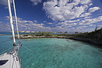 Bow of a Shannon Shoalsailor moored in a bay. This innovative beachboat is a shallow draft boat designed to roam shallow waters such as these in Exuma, the Bahamas.