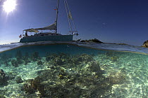 Split-level view of the hull of a Shannon Shoalsailor illustrating how this innovative, keelless, shallow draft beachboat is designed to roam shallow waters such as these in Exuma, the Bahamas. Proper...