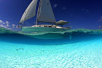 Split-level view of the hull of a Shannon Shoalsailor illustrating how this innovative, keelless, shallow draft beachboat is designed to roam shallow waters such as these in Exuma, the Bahamas.