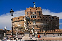 View of the Castel Sant'Angelo and the angel statues on the Ponte Sant' Angelo (Angel's Bridge), Rome, Italy. ^^^The castle is also known as the Mausoleum of Hadrian as it was commissioned by the Roma...