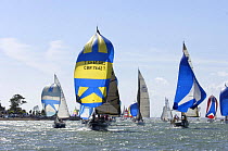 Fleet run downwind off Egypt Point, Cowes Isle of Wight during Skandia Cowes Week, Solent, UK day 2 July 30, 2006.