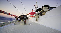 Ropes and winch onboard 88ft sloop yacht "Shaman" cruising at sunset, Dominican Republic, Caribbean.