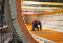 Wooden boat "Bystander" being rebuilt, she was the original tender for the old J-Class yacht "Ranger", Newport, Rhode Island, USA.