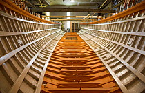 Wooden boat "Bystander" whilst being rebuilt, she was the original tender for the old J-Class yacht "Ranger", Newport, Rhode Island, USA.