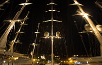 Lit masts of superyacht sailboats docked during the St Barts Bucket Regatta, St Barthelemy, Caribbean.