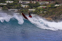 Surfing waves in Baie de Saint Jean, St. Barthélemy, Caribbean.