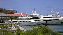Mega motoryachts docked in Baie de Saint Jean, St. Barthélemy, Caribbean.