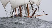 Tall Ship "Jamestown" sailing through large swell in Newport, Rhode Island, USA.