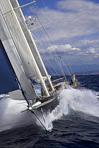 Bow on shot of 140ft luxury schooner "Skylge", designed by André Hoek and built by Holland Jachtbouw, crashing through the waves in the French Riviera, France. Property released.
