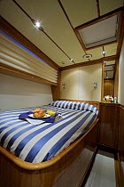 Cabin room with breakfast tray onboard 140ft luxury schooner "Skylge", designed by André Hoek and built by Holland Jachtbouw, sailing in the French Riviera, France. Property released.