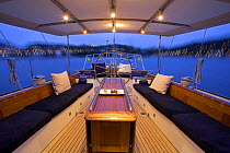 The aft deck set up with cusions and pillows onboard 140ft luxury schooner "Skylge", designed by André Hoek and built by Holland Jachtbouw, sailing in the French Riviera, France. Property released.