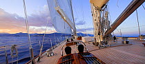 Sailing into the sunset onboard 140ft luxury schooner "Skylge", designed by André Hoek and built by Holland Jachtbouw, sailing in the French Riviera, France. Property released.
