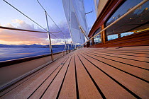 Detail of the teak decking onboard 140ft luxury schooner "Skylge", designed by André Hoek and built by Holland Jachtbouw, sailing in the French Riviera, France. Property released.