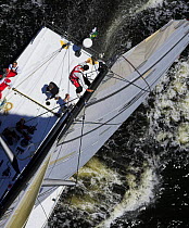 Crewman climbing down the mast during the Onion Patch Series 2006 in Newport, Rhode Island, USA.