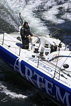 Brian Thompson, skipper of Open 60 "Artemis Ocean Racing" at the helm.