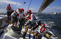The crew onboard "Maximus" working together at the start of the 2006 Newport to Bermuda Race, Rhode Island, USA.