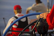 The skipper with his hand on the wheel, steering "Maximus" in the 2006 Newport to Bermuda race.