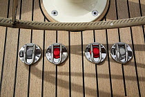 Electric winch buttons on the deck aboard cruising yacht. Rhode Island, USA.