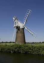 Windmill by the water, Norfolk Broads, England, UK.