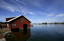 A wooden boathouse on the water, Vano, Finnish Archipelago, Finland.