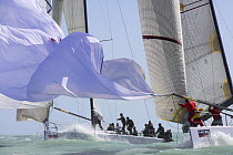 Losing the spinnaker sail during one-design class racing at Key West Race Week 2006, Florida, USA.