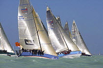 One-design classes lining up at the start line for a race, Key West Race Week 2006, Florida, USA.