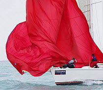 Spinnaker drop on a one-design class yacht, Key West Race Week 2006, Florida, USA.