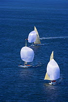12m yachts racing downwind under spinnakers in the 2006 12 Metre North American Championships, Newport, Rhode Island, USA.