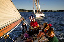 Evening charter onboard 12m yacht "Gleam" sailing in Narragansett Bay off Newport, Rhode Island, USA. September 2006.