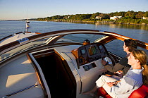 Hinckley T38R speedboat cruising on a calm evening, Rhode Island, USA.