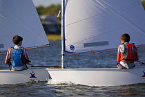 Children sailing Vanguard Optimist dinghies, Charleston, South Carolina, USA.