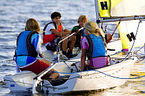 Children Vanguard RS dinghy sailing, Charleston, South Carolina, USA.