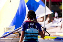A competitor in the Sunfish World Championship, Charleston, South Carolina, USA.